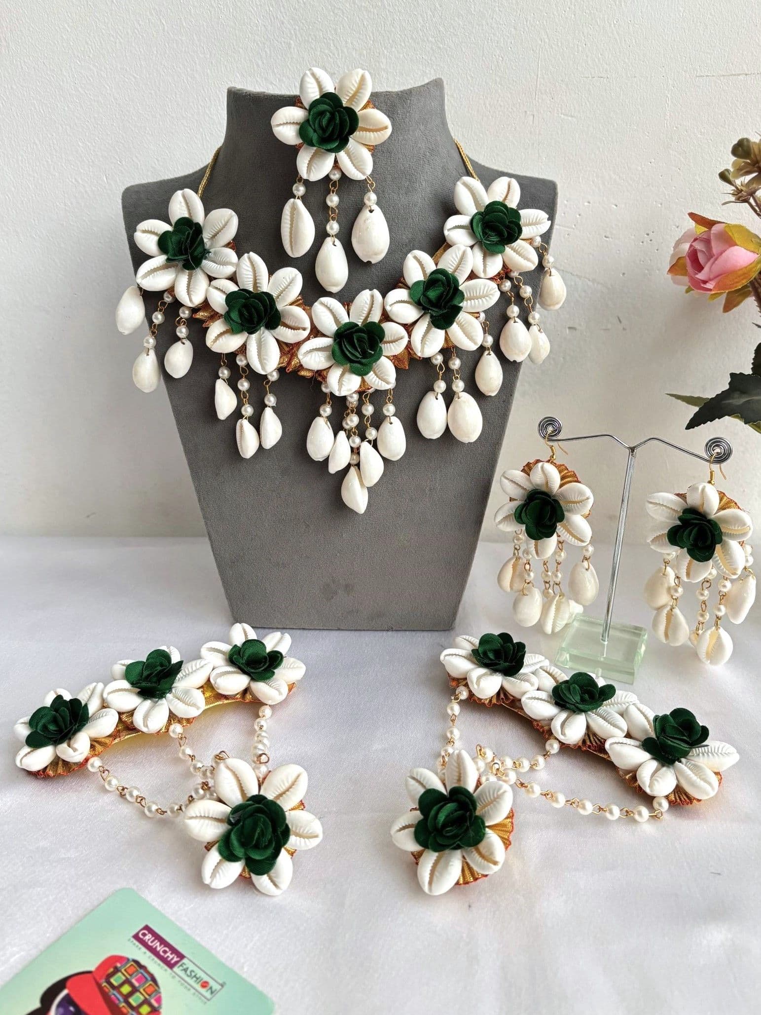Green floral bridal jewellery set for haldi, mehndi featuring artificial flowers and shell material