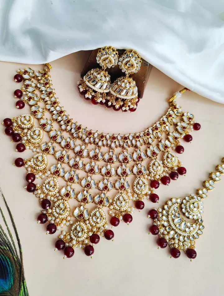 Maroon Elegance: Gold-plated Kundan Jewellery Set fit for Your Special Occasions